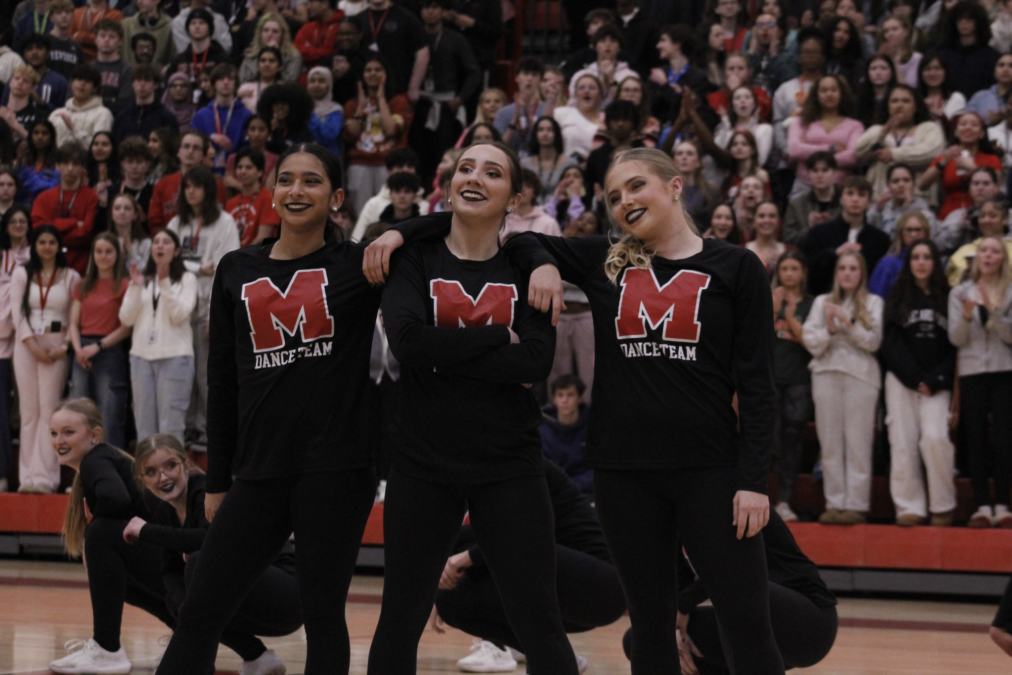 Senior Dazzlers Aileen Vohra (12, HSU), Olivia Helmer (12, HSU) and Autumn Harper (12, YPAS) pose after their performance. 